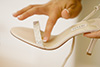 Thumbnail of Placing Coin in Brides Shoe